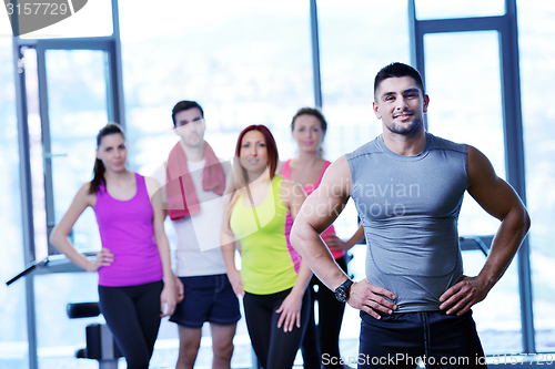 Image of Group of people exercising at the gym