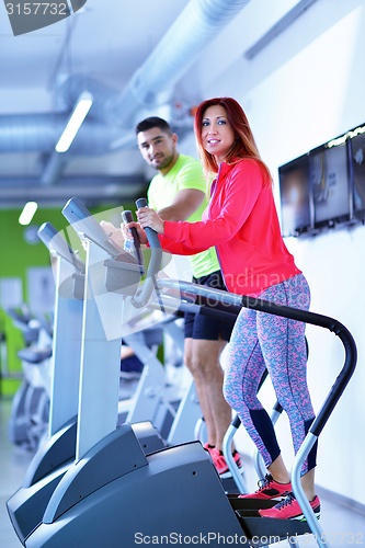 Image of Group of people running on treadmills