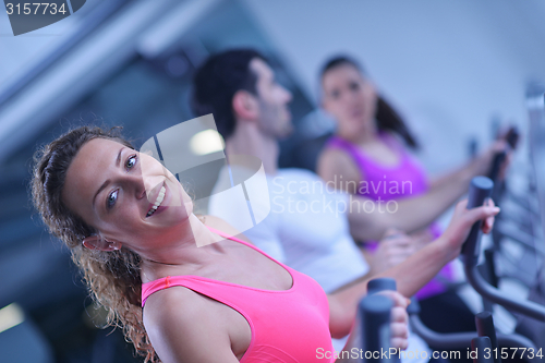 Image of Group of people running on treadmills