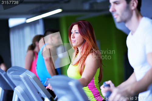 Image of Group of people running on treadmills
