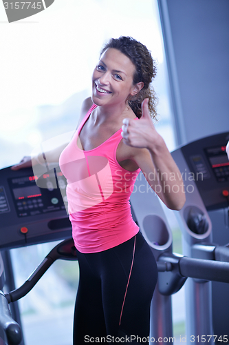 Image of woman exercising on treadmill in gym