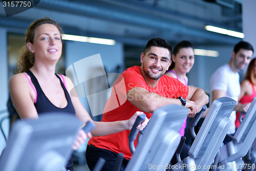 Image of Group of people running on treadmills