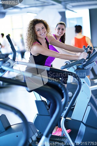 Image of Group of people running on treadmills