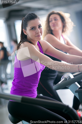 Image of Group of people running on treadmills