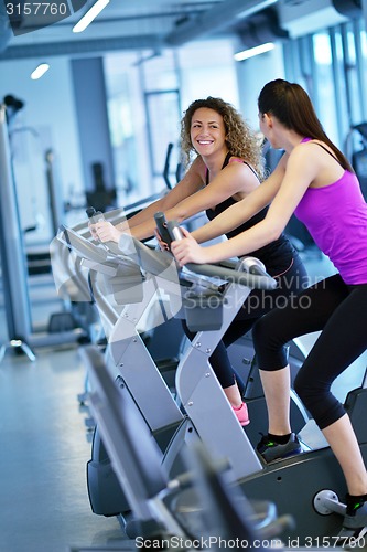 Image of Group of people running on treadmills