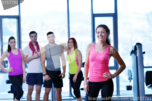 Image of Group of people exercising at the gym