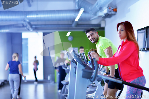 Image of Group of people running on treadmills