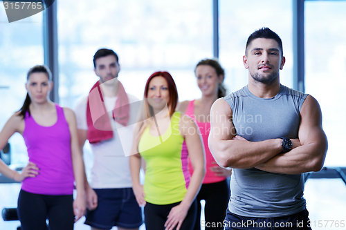 Image of Group of people exercising at the gym