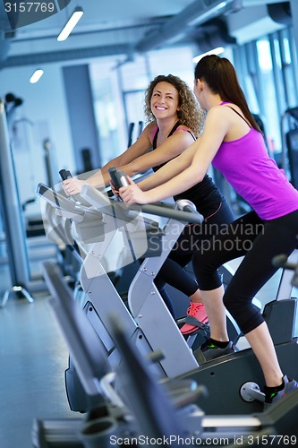 Image of Group of people running on treadmills