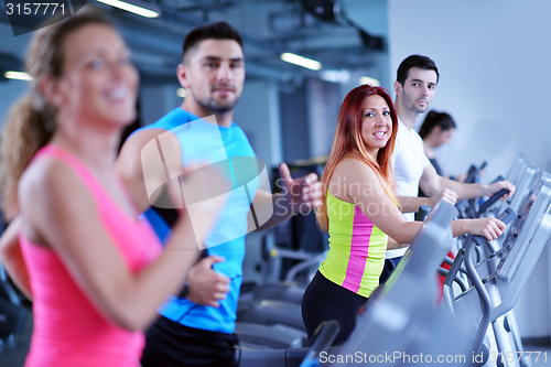 Image of Group of people running on treadmills