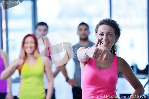 Image of Group of people exercising at the gym