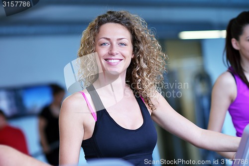 Image of Group of people running on treadmills