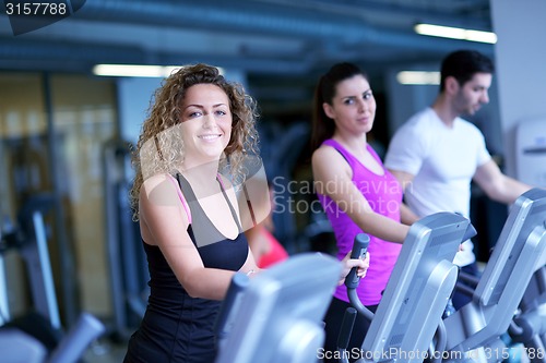 Image of Group of people running on treadmills