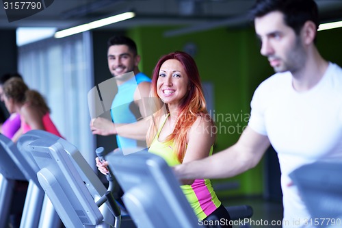 Image of Group of people running on treadmills