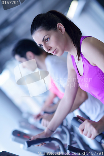 Image of woman exercising on treadmill in gym