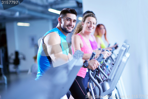 Image of Group of people running on treadmills