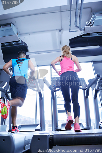 Image of Group of people running on treadmills