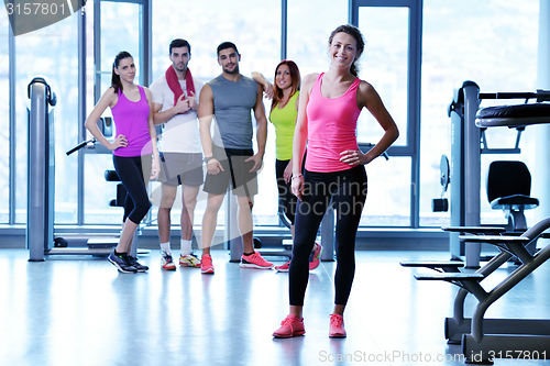 Image of Group of people exercising at the gym