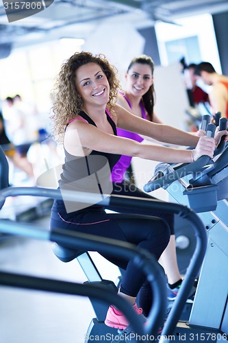 Image of Group of people running on treadmills