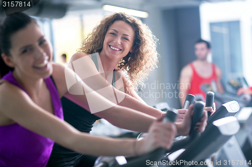 Image of Group of people running on treadmills