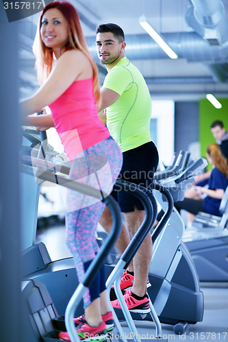 Image of Group of people running on treadmills