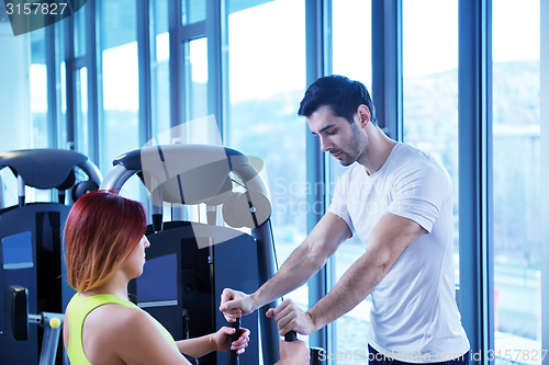 Image of woman exercising with her personal trainer