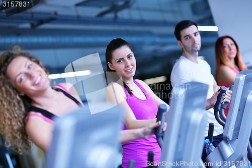 Image of Group of people running on treadmills