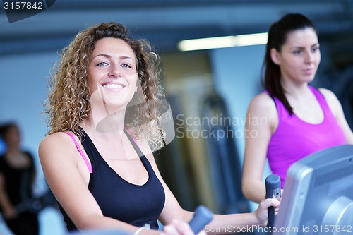 Image of Group of people running on treadmills