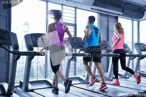 Image of Group of people running on treadmills