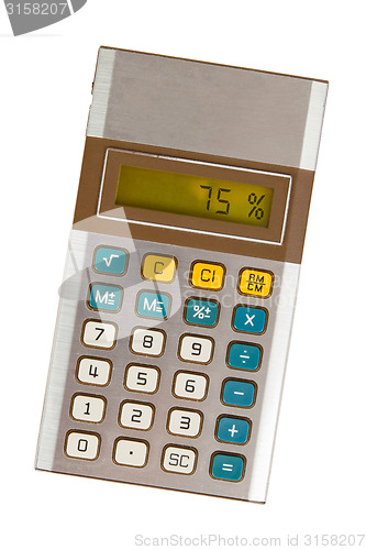 Image of Old calculator showing a percentage - 75 percent