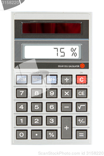 Image of Old calculator showing a percentage - 75 percent