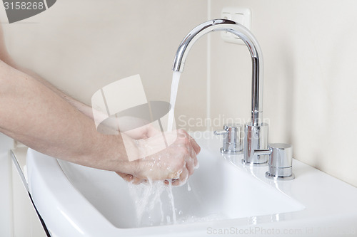 Image of Hands under the tap