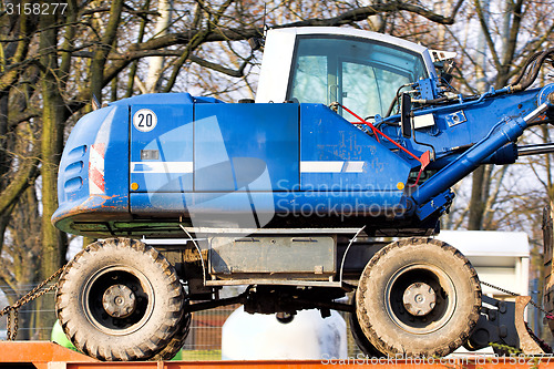 Image of  Digger-loader on a trailer