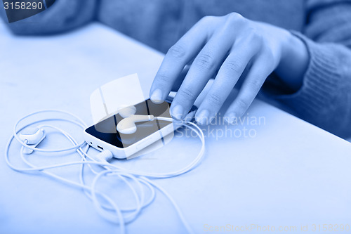 Image of Smartphone with earphones