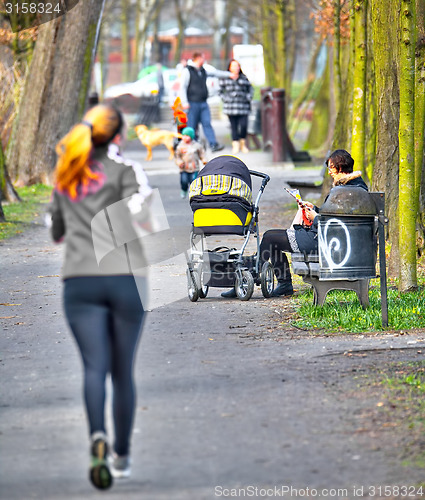 Image of Young mother with  pram 