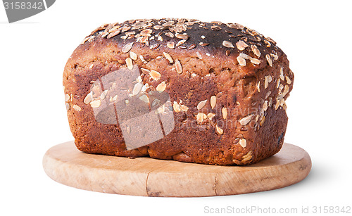 Image of Unleavened bread with seeds on wooden board