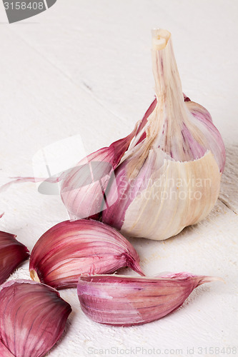 Image of Fresh garlic bulb with loose cloves