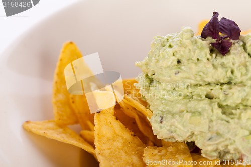 Image of Crisp corn nachos with guacamole sauce