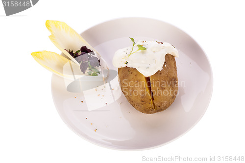 Image of Baked jacket potato with sour cream sauce