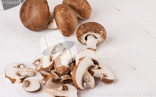 Image of Diced and whole agaricus brown button mushrooms