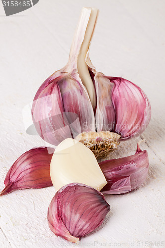 Image of Fresh garlic bulb with loose cloves