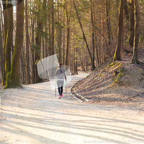 Image of Woman hiking in nature. 