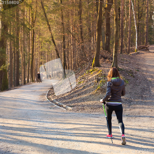 Image of Woman hiking in nature. 