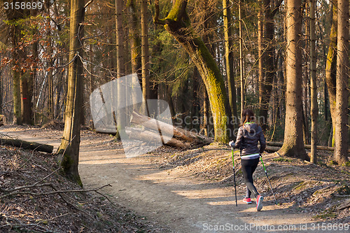 Image of Woman hiking in nature. 