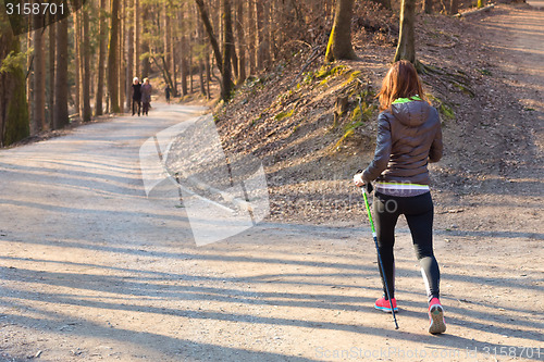 Image of Woman hiking in nature. 