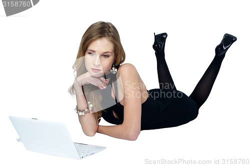 Image of Attractive blonde girl with laptop