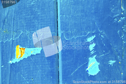 Image of stripped paint in the blue yellow