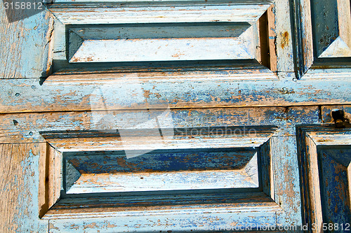 Image of dirty  paint   the blue  door  rusty nail