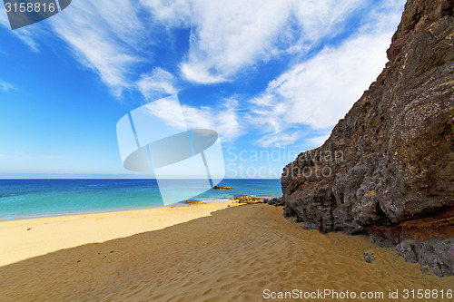 Image of white coast lanzarote  in spain   beach  stone water  and  