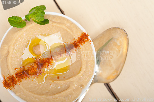 Image of Hummus with mint on top